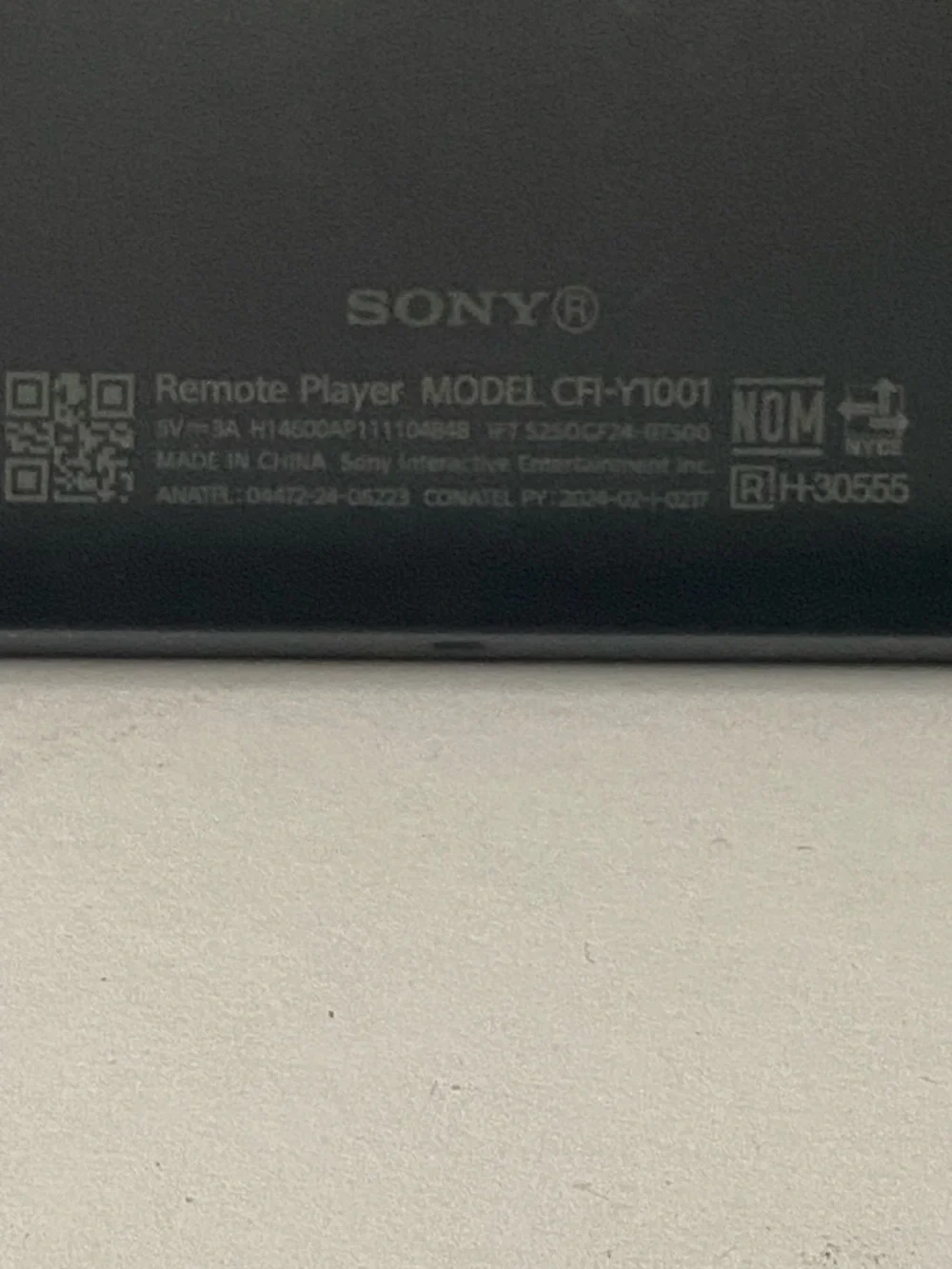 Sony PlayStation Portable-style Handheld with White Side Controllers